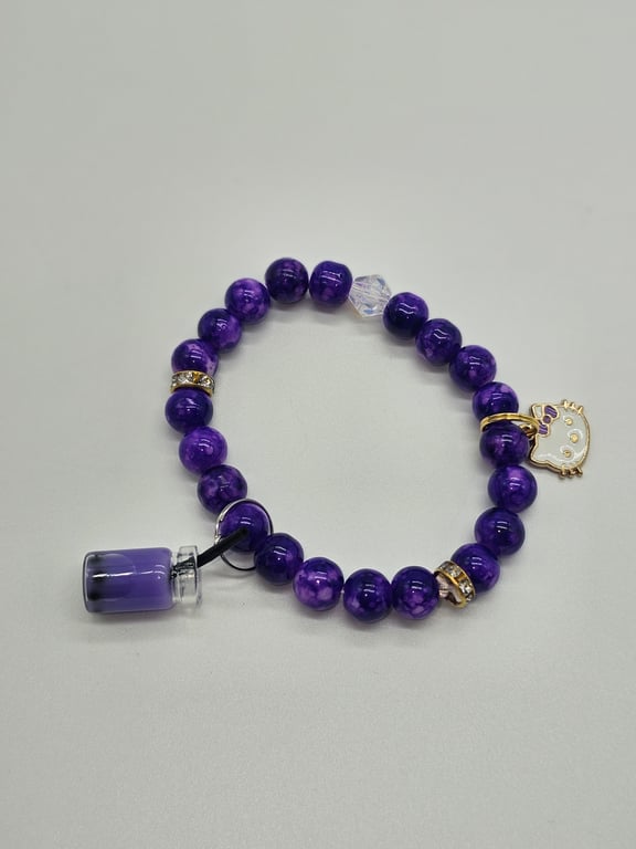 Purple Beaded Stretch Bracelet with Gold Spacers and Charms — photo 2