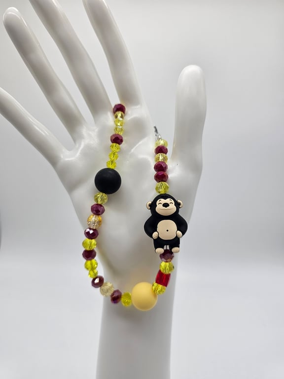 Burgundy and Yellow Monkey Wristlet