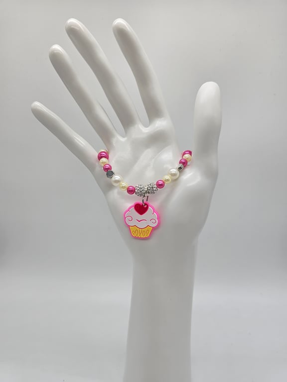 Pink and White Beaded Stretch Bracelet with Cupcake Charm