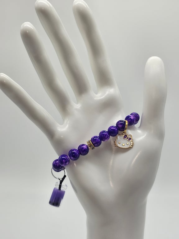 Purple Beaded Stretch Bracelet with Gold Spacers and Charms — photo 1
