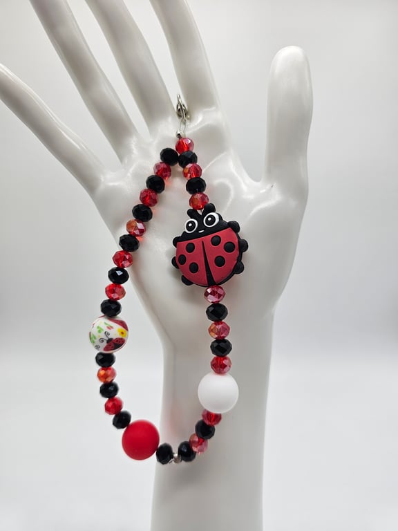 Red and Black Beaded Phone Wristlet with Ladybug Charm