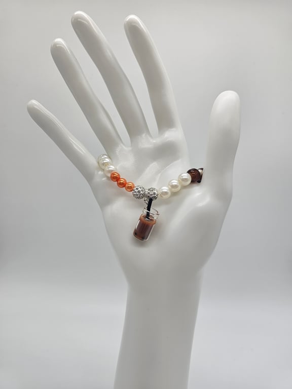 White and Orange Beaded Charm Bracelet