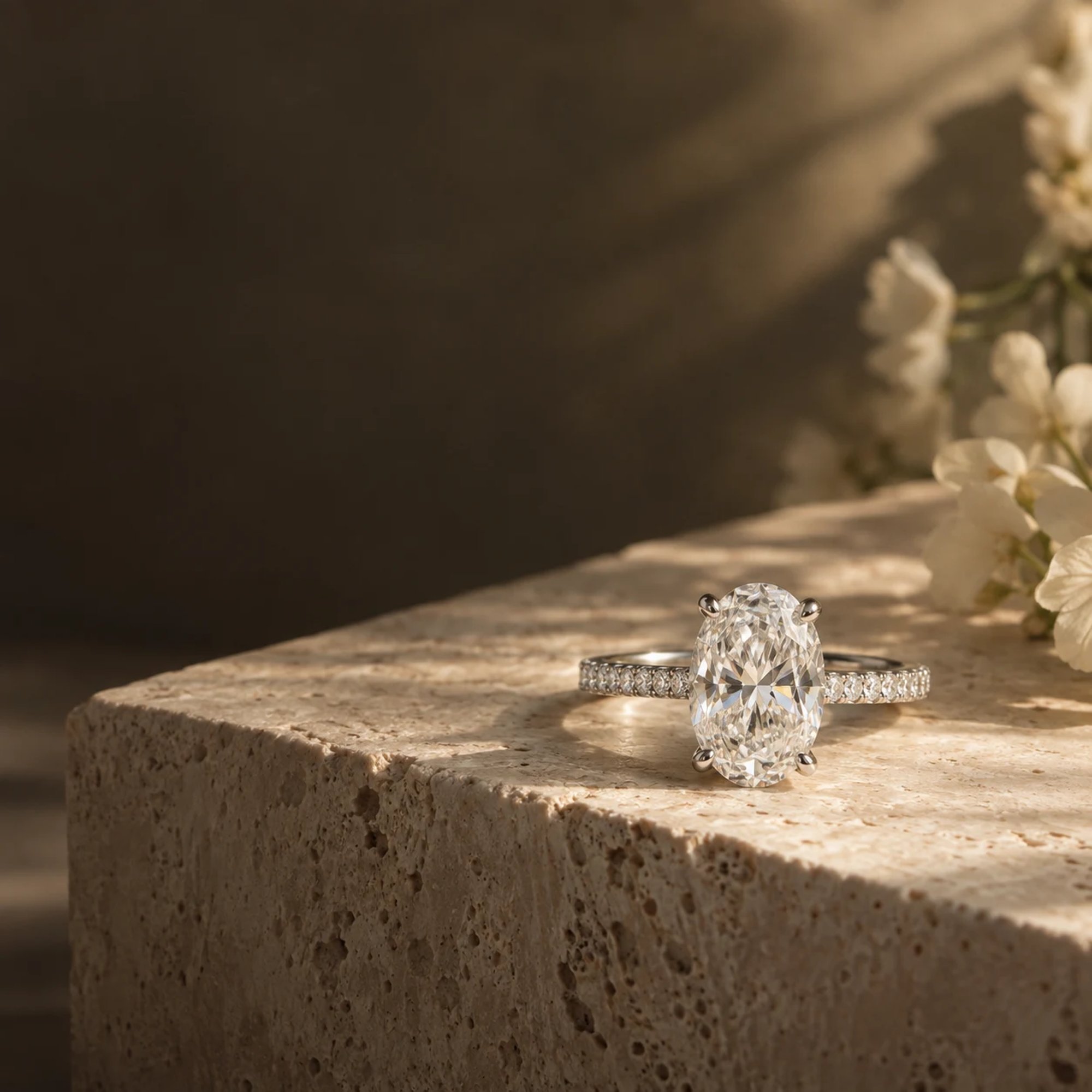 Diamond engagement ring presented in a dark green ring box