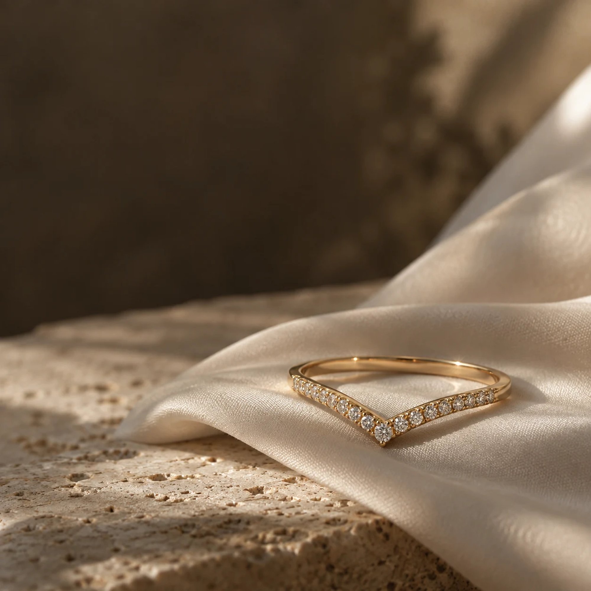 Diamond wedding bands displayed on ivory fabric