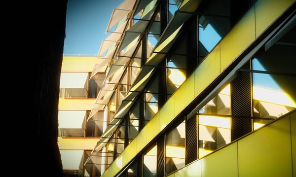 Reflection on Children's Hospital. Kinderspital, Basel, Switzerland, 7:20 PM, Monday, 13 May 2024. Fujifilm X100VI, flash off, f/4 at 1/300 at Auto ISO 250. Reggie's Portra + Glimmerglass + Luminar Neo.