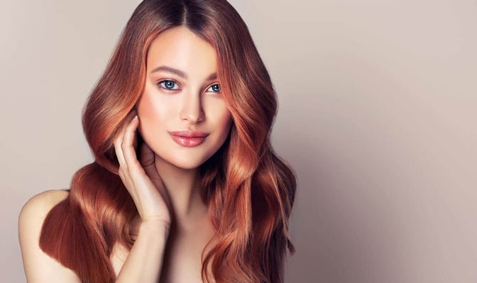 Why You Should Use the Best Moisturizing Shampoo for Color Treated Hair. Young, red haired beautiful model with long, curly, well groomed hair. Excellent hair waves. Hairdressing art and hair care. stock photo