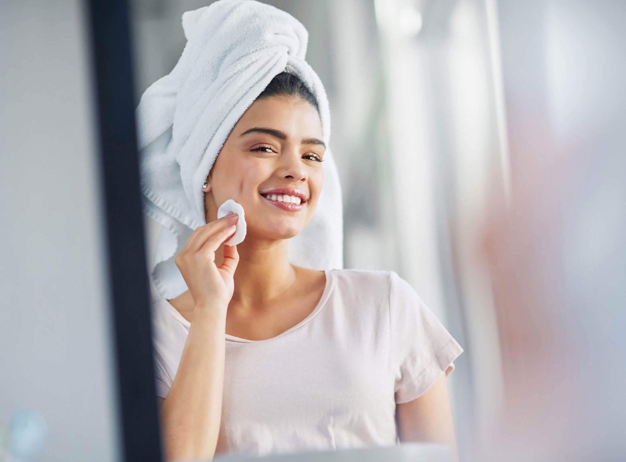 Top Tips for Cleansing Your Skin. Cleansing her skin to reveal her natural beauty stock photo