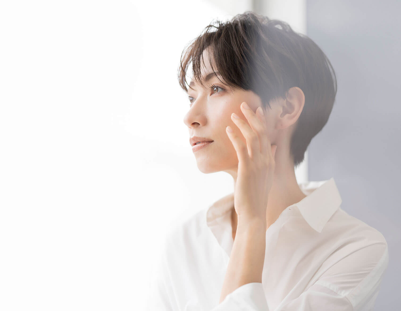 How To Remove Age Spots. A profile portrait of an Asian woman. stock photo