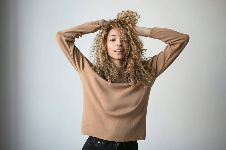 Top Benefits of Vitamin C for Hair. Photo of a Happy girl with white background.