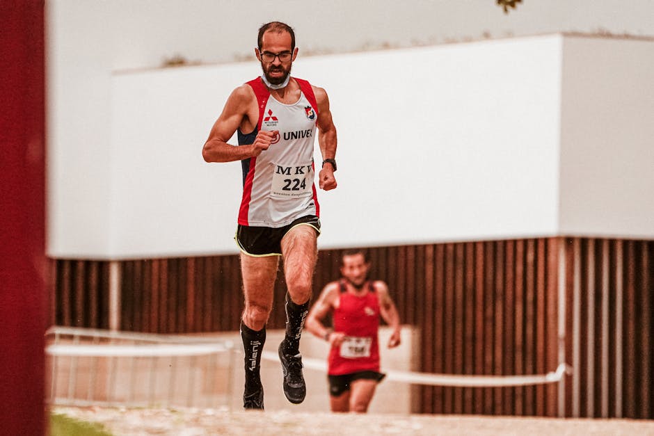 Runners in motion during a competitive race in an urban environment.