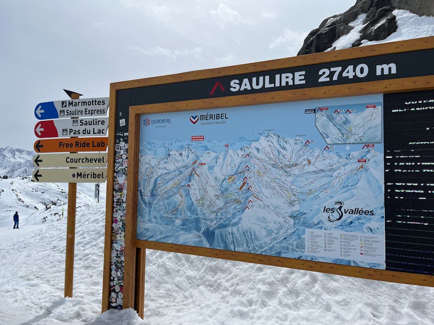 Ski map signage at Saulire summit in Les Allues, showcasing ski routes in Les Trois Vallées.