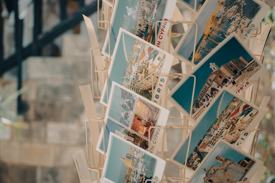 Rack of vibrant Cyprus postcards showcasing scenic views and landmarks.