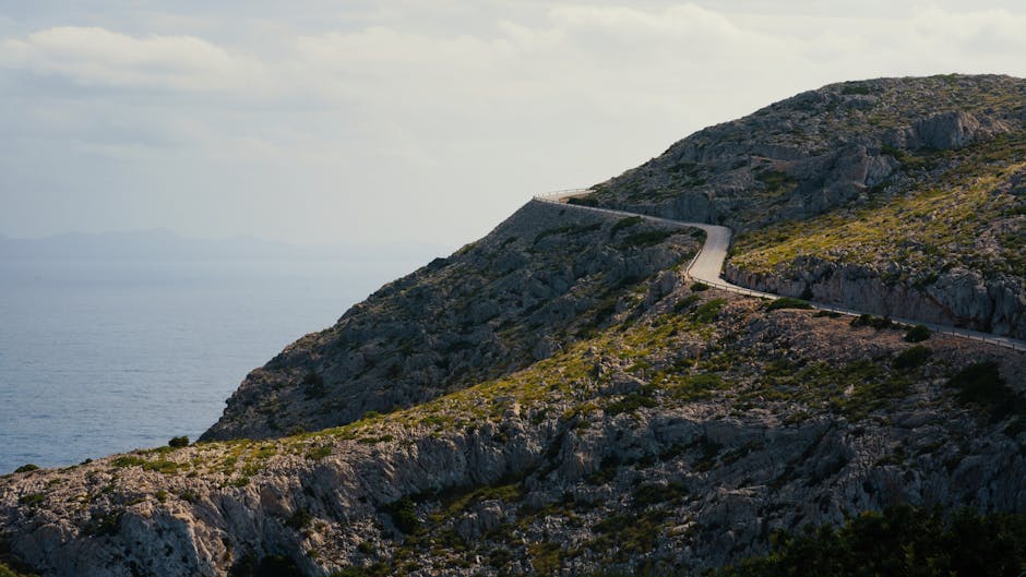 Capture of a winding road along the rugged coastline of Mallorca, Spain.