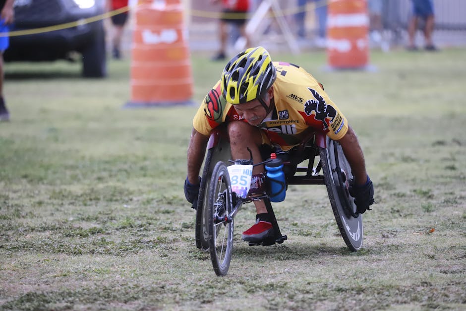 Determined wheelchair racer competing in an outdoor marathon, displaying focus and athleticism.