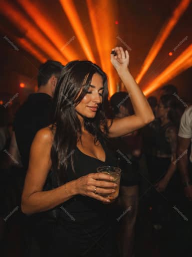 Woman Dancing With Drink Under Orange Lasers Club Glow Portrait JPG