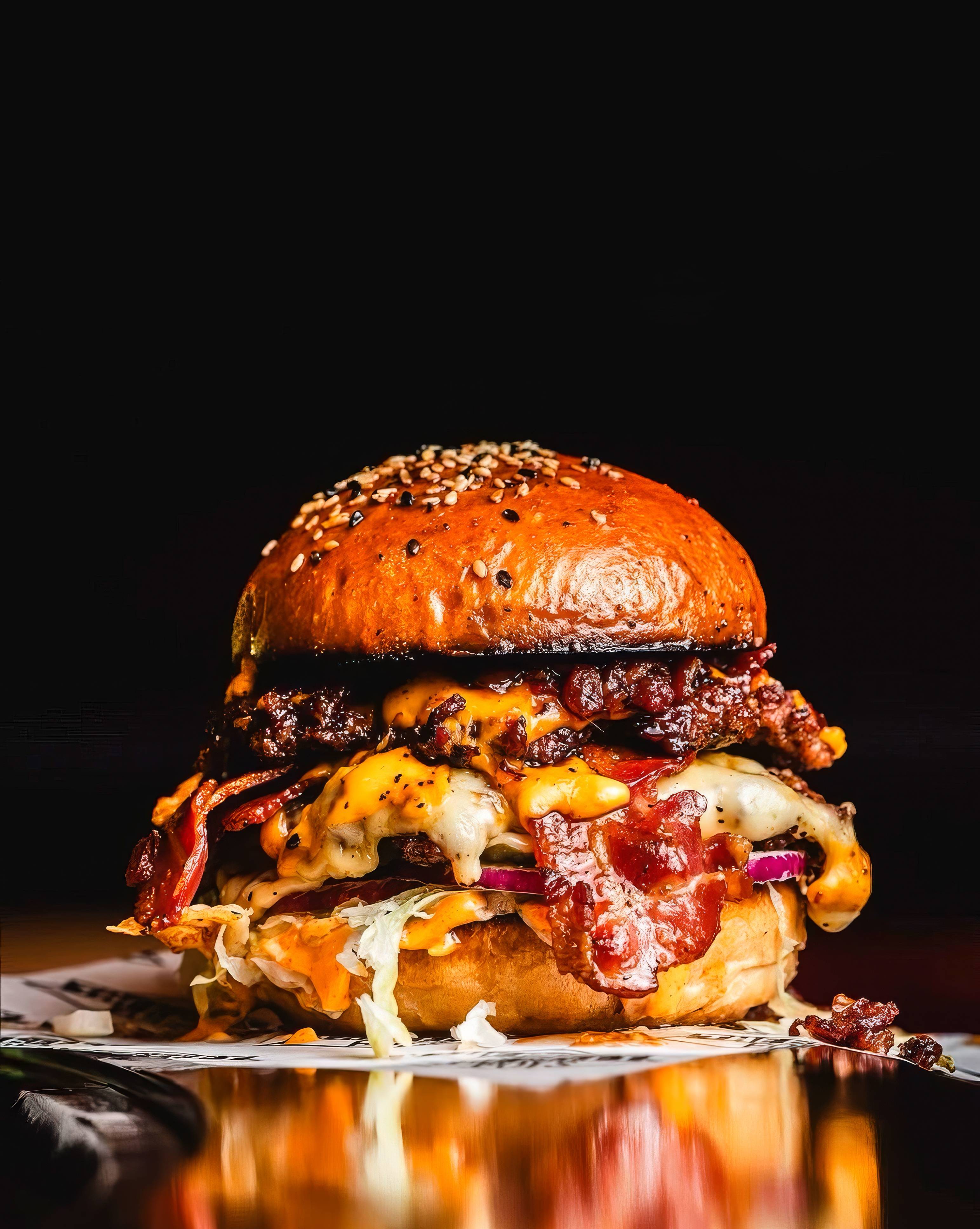 Gourmet Bacon Cheeseburger On Black Background