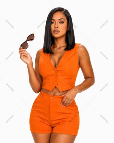 Woman In Orange Vest And Shorts Holding Sunglasses Photo