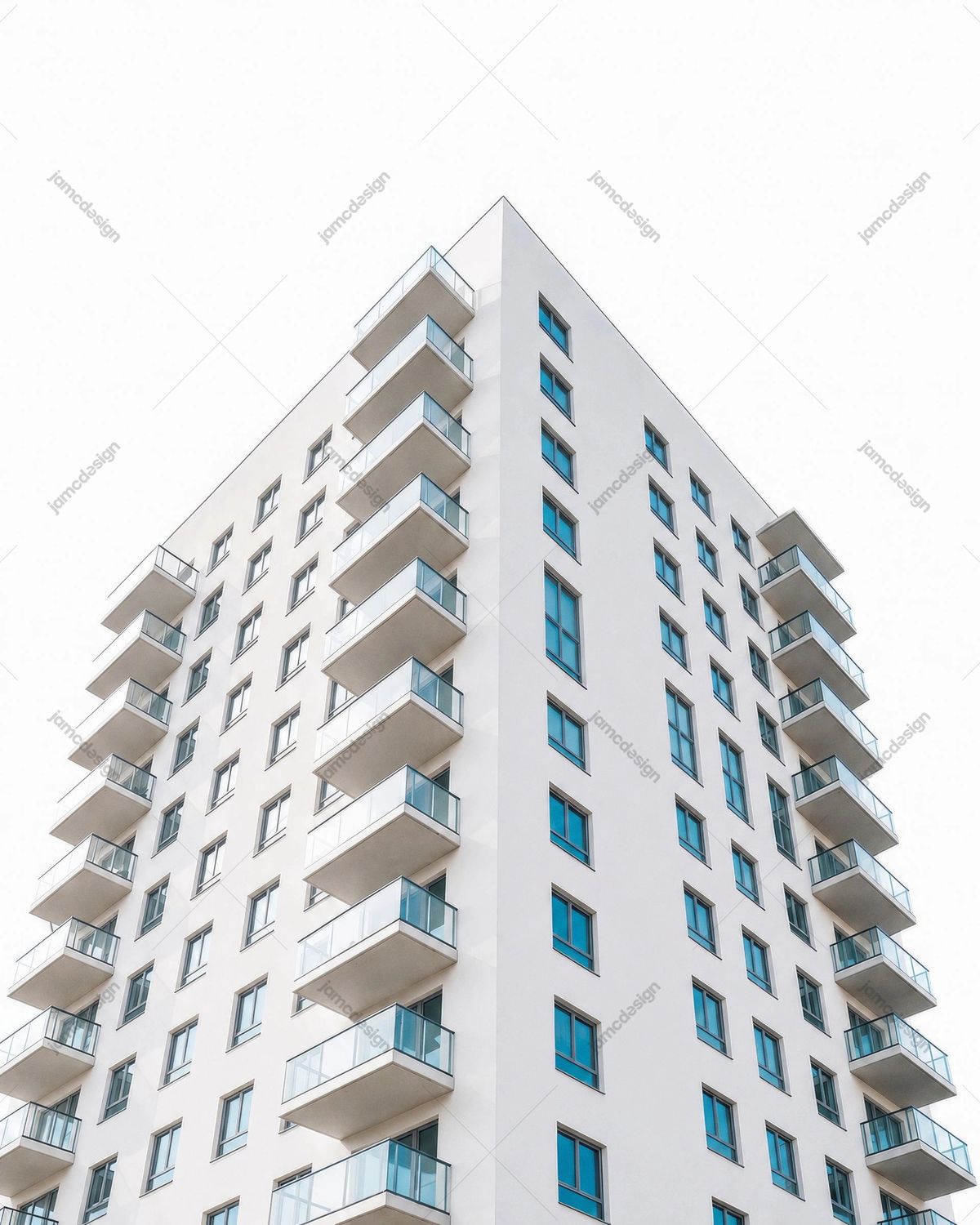Modern White Apartment Building Exterior with Glass Balconies
