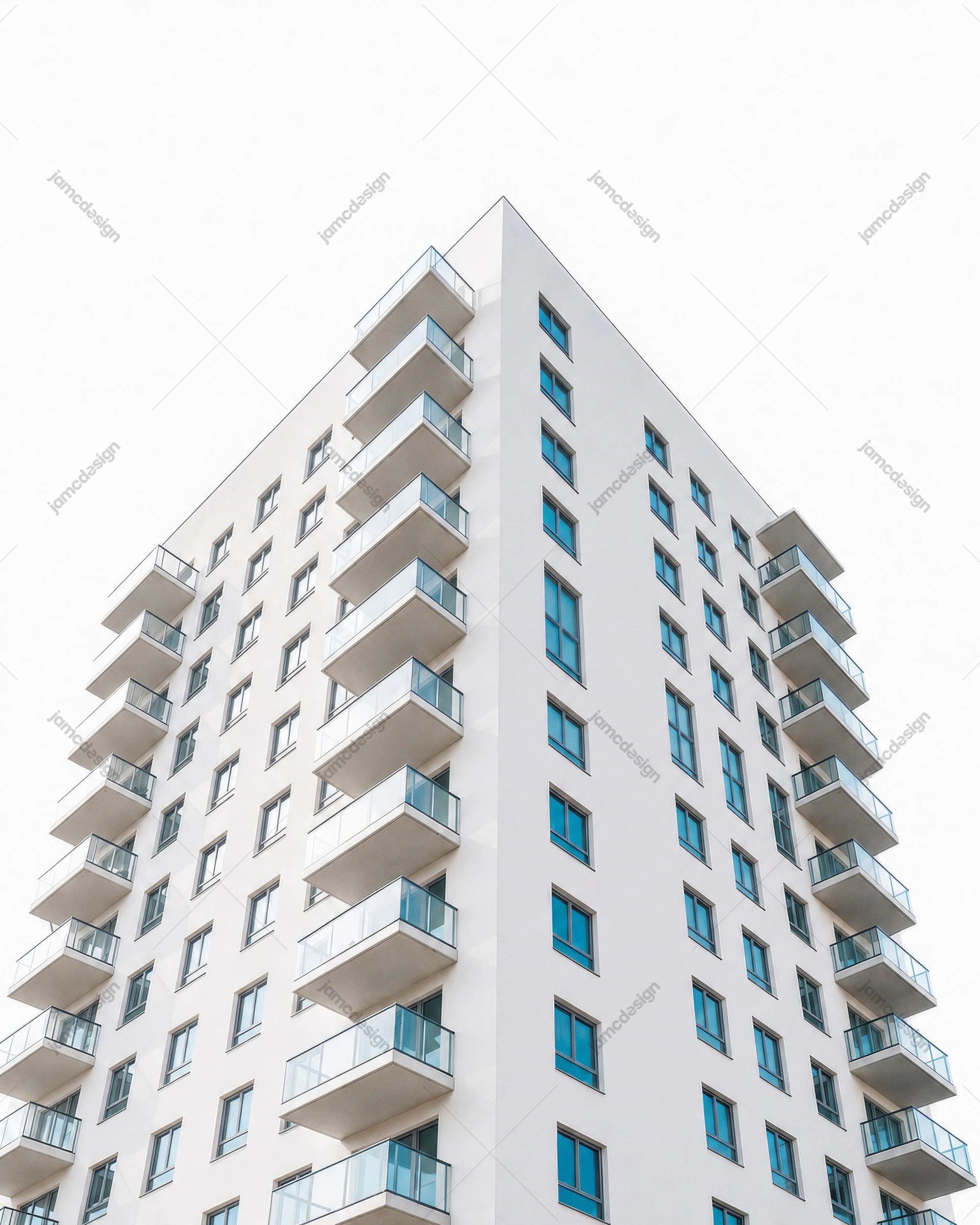 Modern White Apartment Building Exterior with Glass Balconies