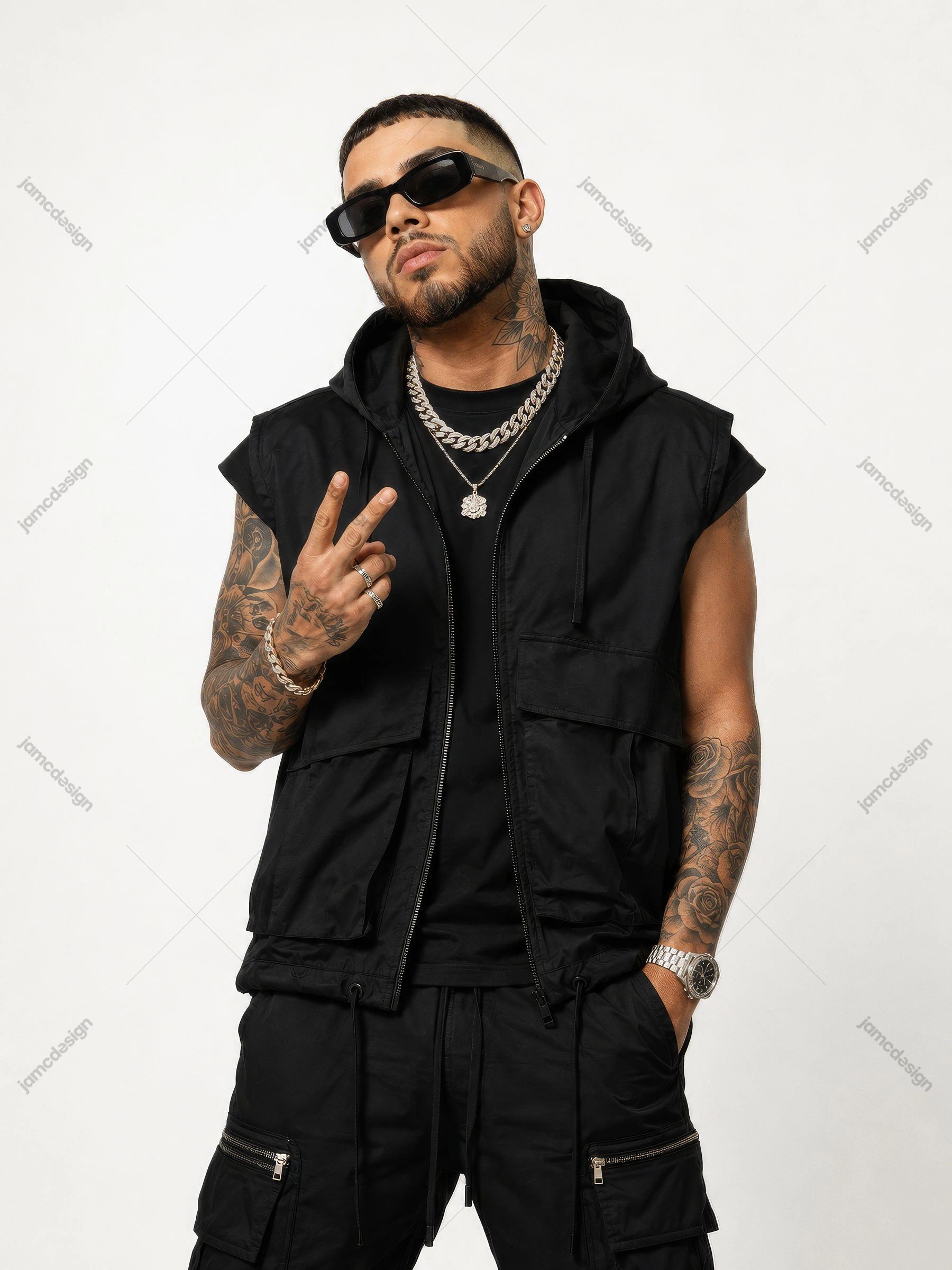 Tattooed Male Reggaeton Artist Black Streetwear Portrait. JPG photo of a tattooed man wearing black streetwear