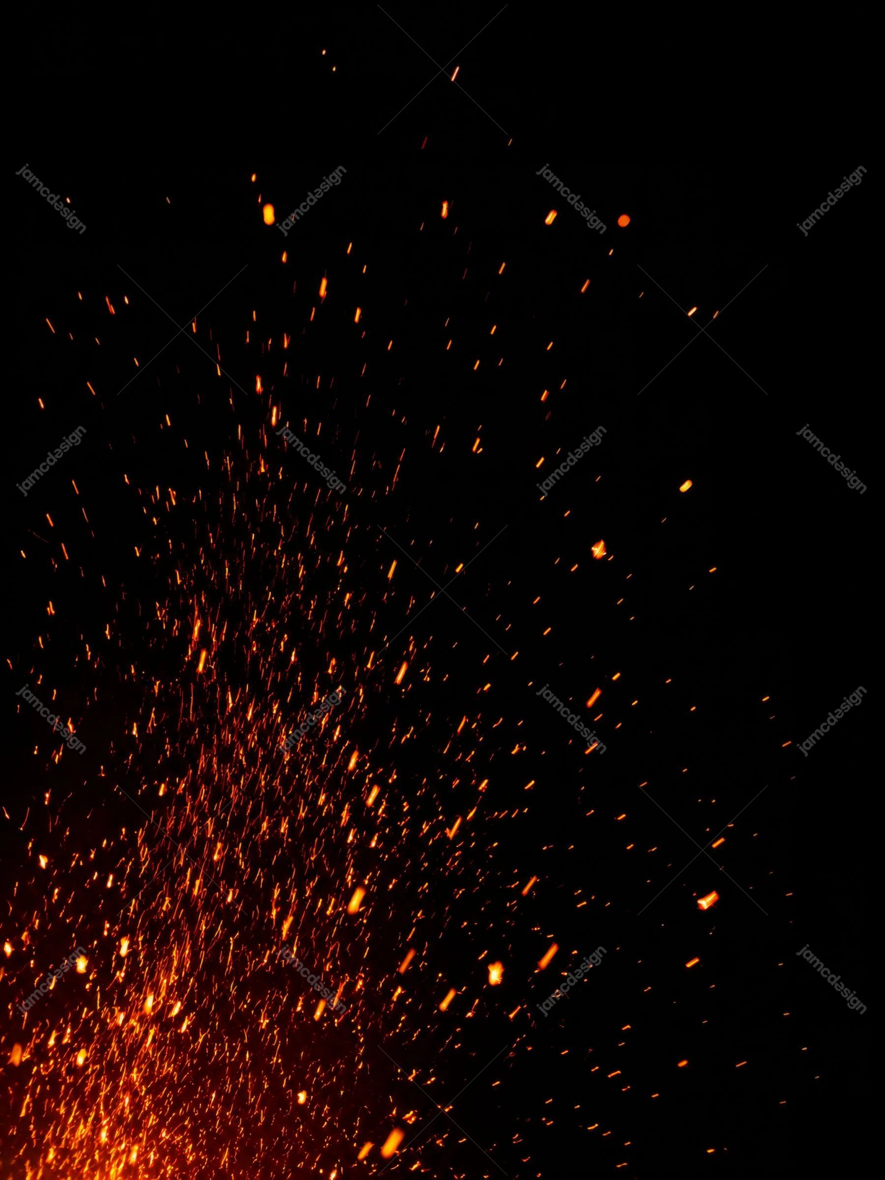 Glowing Fire Particles On Black Orange Spark Burst Background Texture. JPG texture showing a burst of orange fire sparks rising through a deep black field