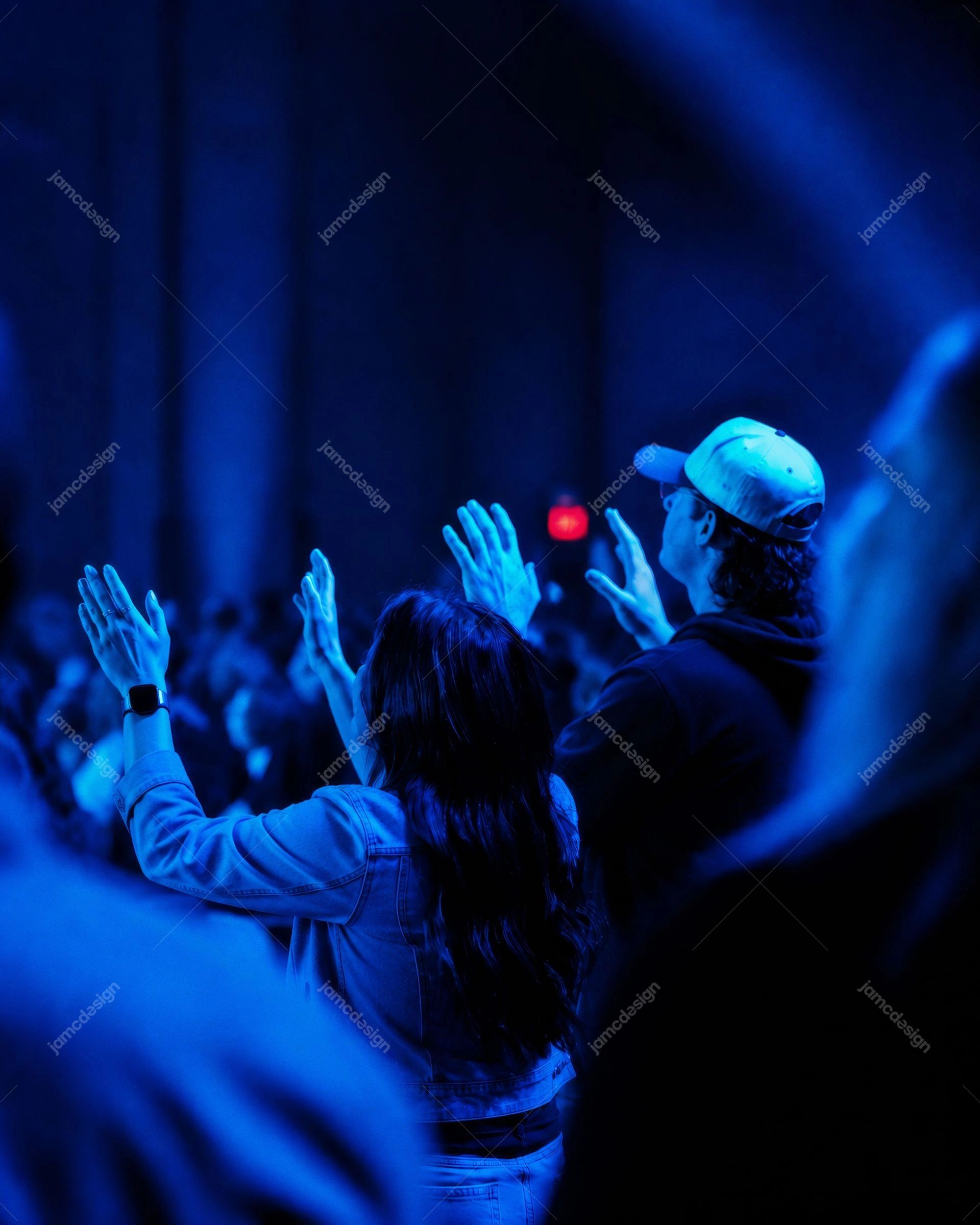 Worship Crowd Raising Hands Under Blue Stage Lights Photography