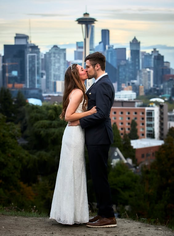 Newlyweds sharing their first dance surrounded by warm lighting