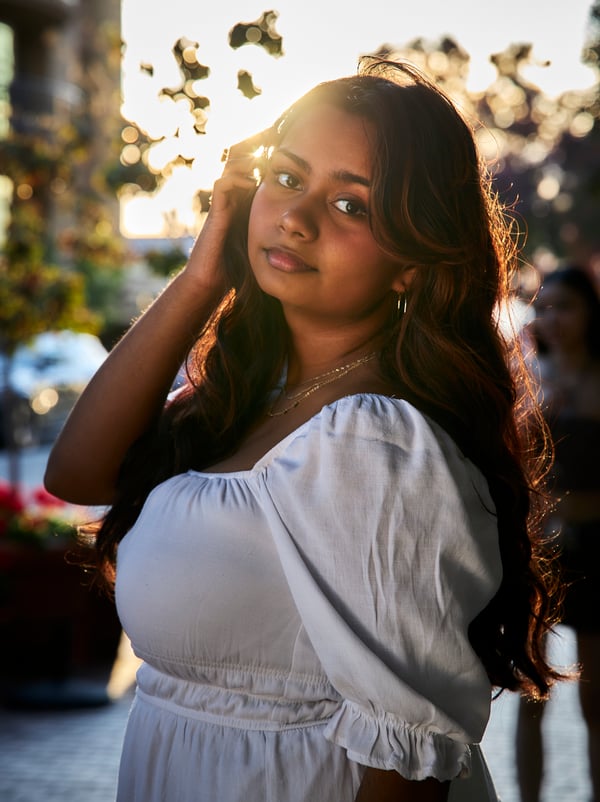 Confident portrait subject gazing into the camera under soft natural light