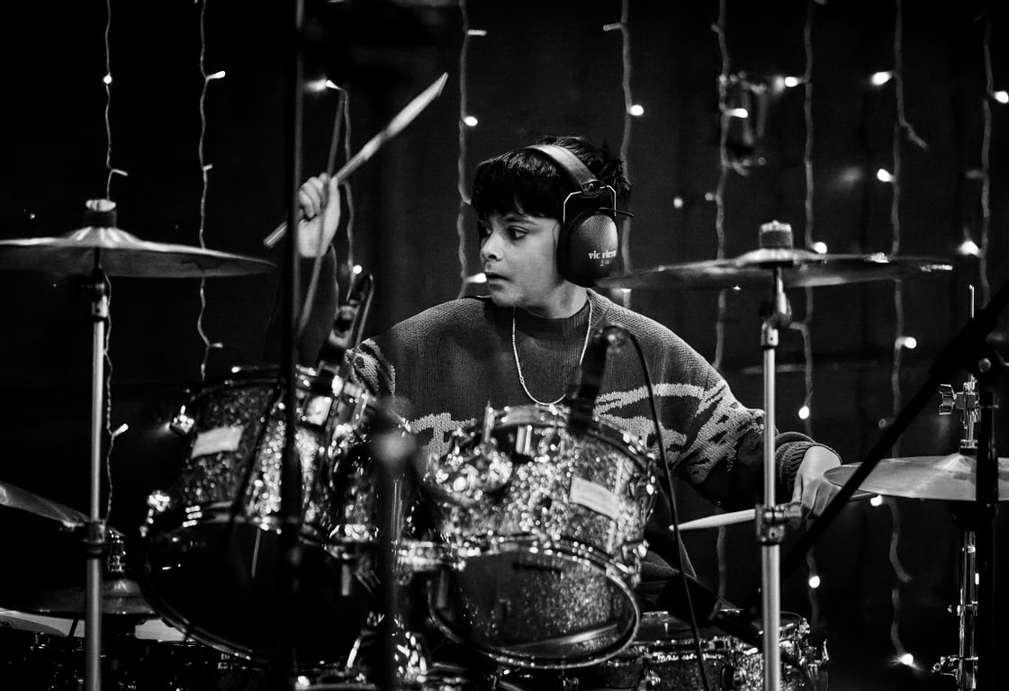 Mid-performance moment captured during a live drum recital