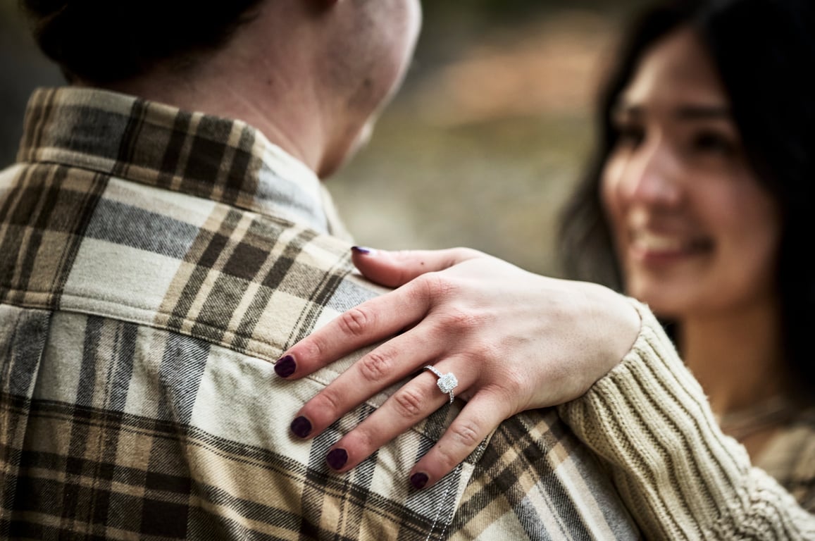Couple looking at each other with quiet warmth outdoors