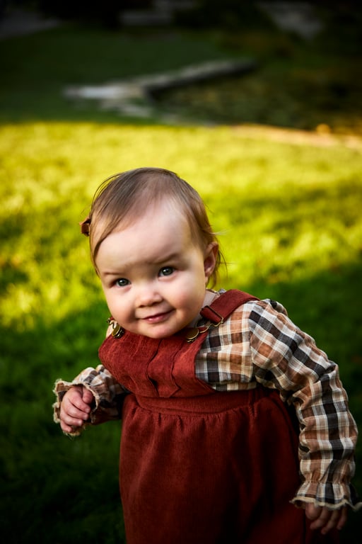 Baby smiling during a gentle quiet moment with parent
