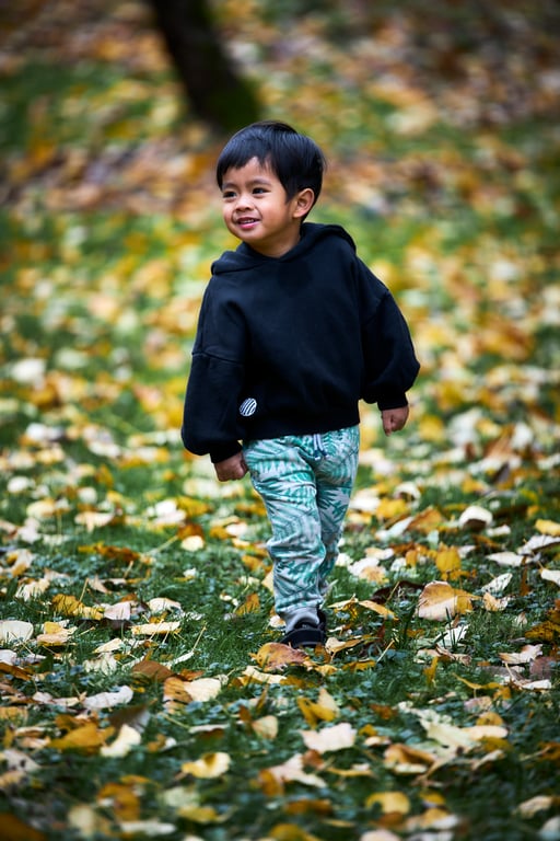 Young child caught in a playful candid outdoor moment