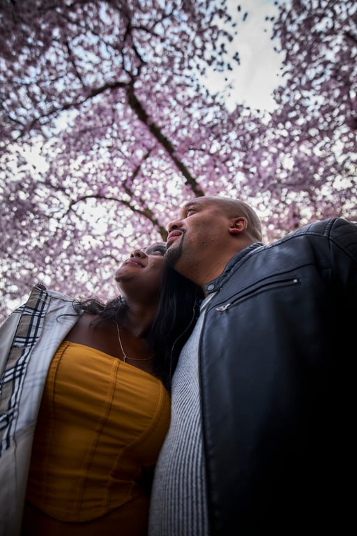 Couple walking together through a lush outdoor garden