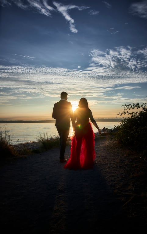 Couple standing close together within a lush garden setting