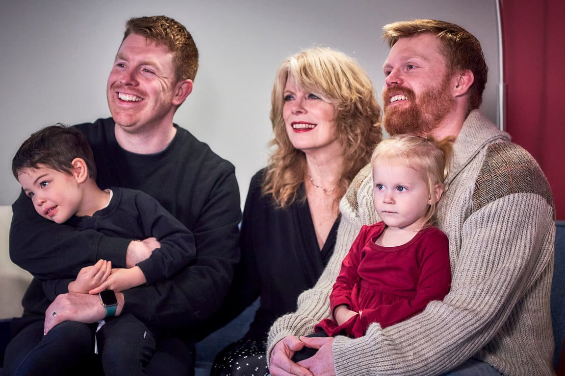 Family sharing a candid laugh during their photo session