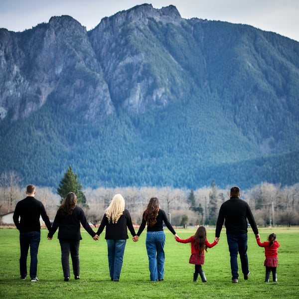 Family gathered together for a warm outdoor group portrait