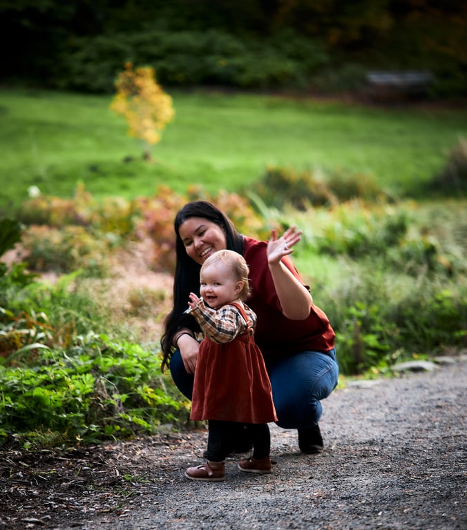 Family sharing warm smiles during their portrait session