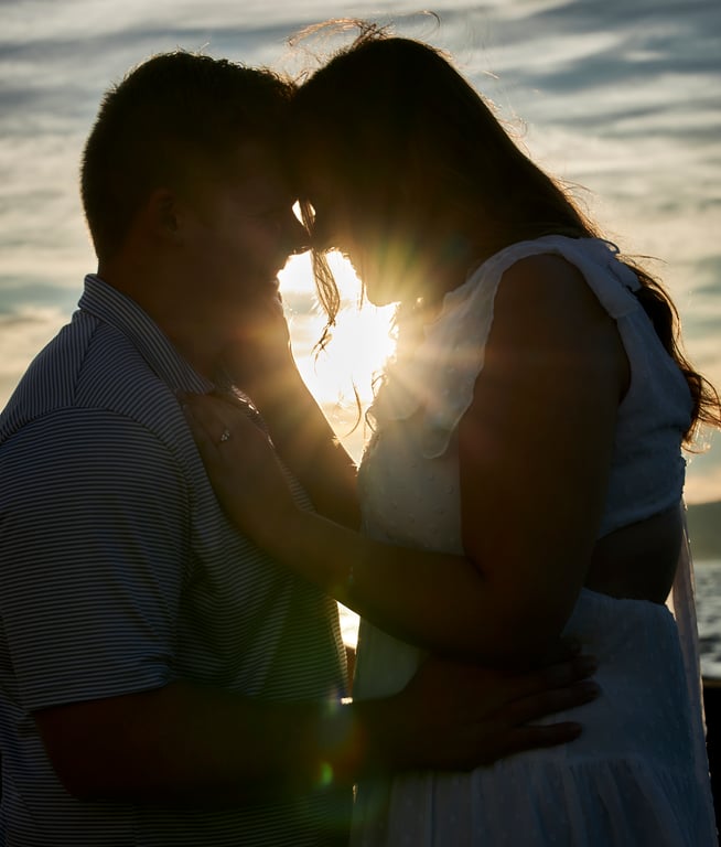 Couple posed together within a scenic Pacific Northwest landscape