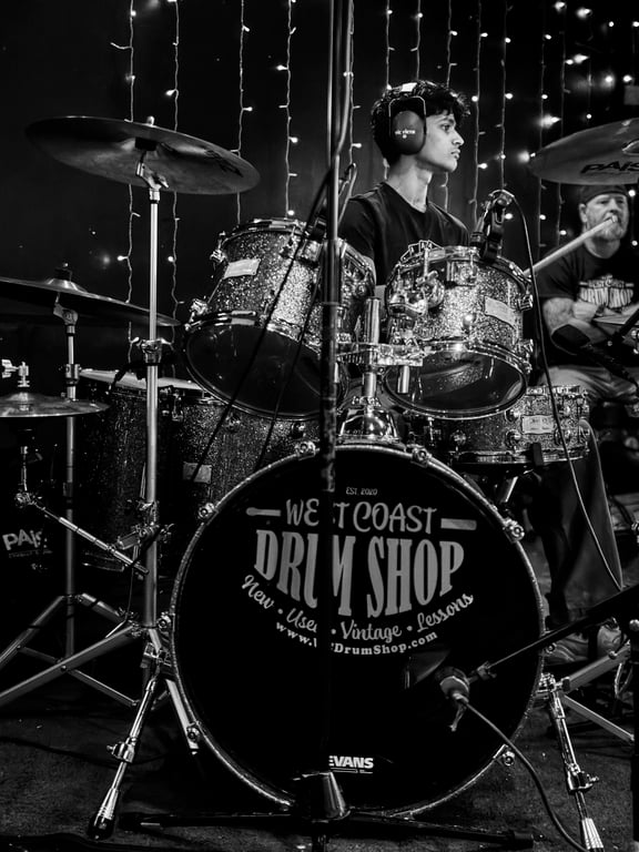 Performer taking a bow after a live drum recital