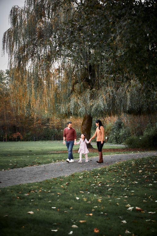 Family walking together through a peaceful park setting