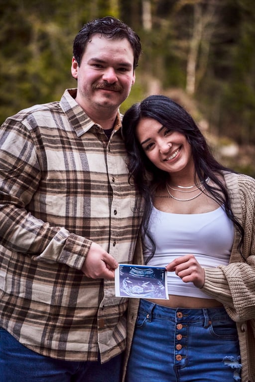 Couple posed together surrounded by peaceful nature