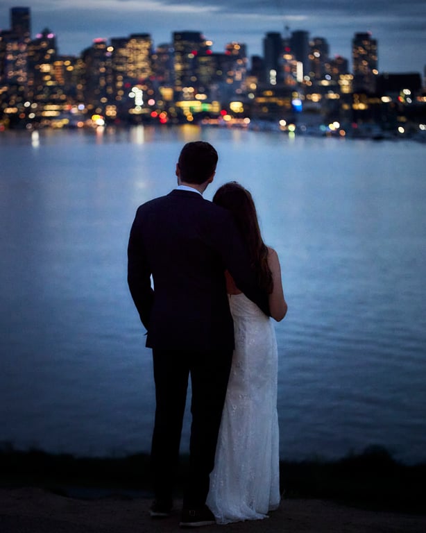Couple sharing a quiet intimate moment away from the crowd