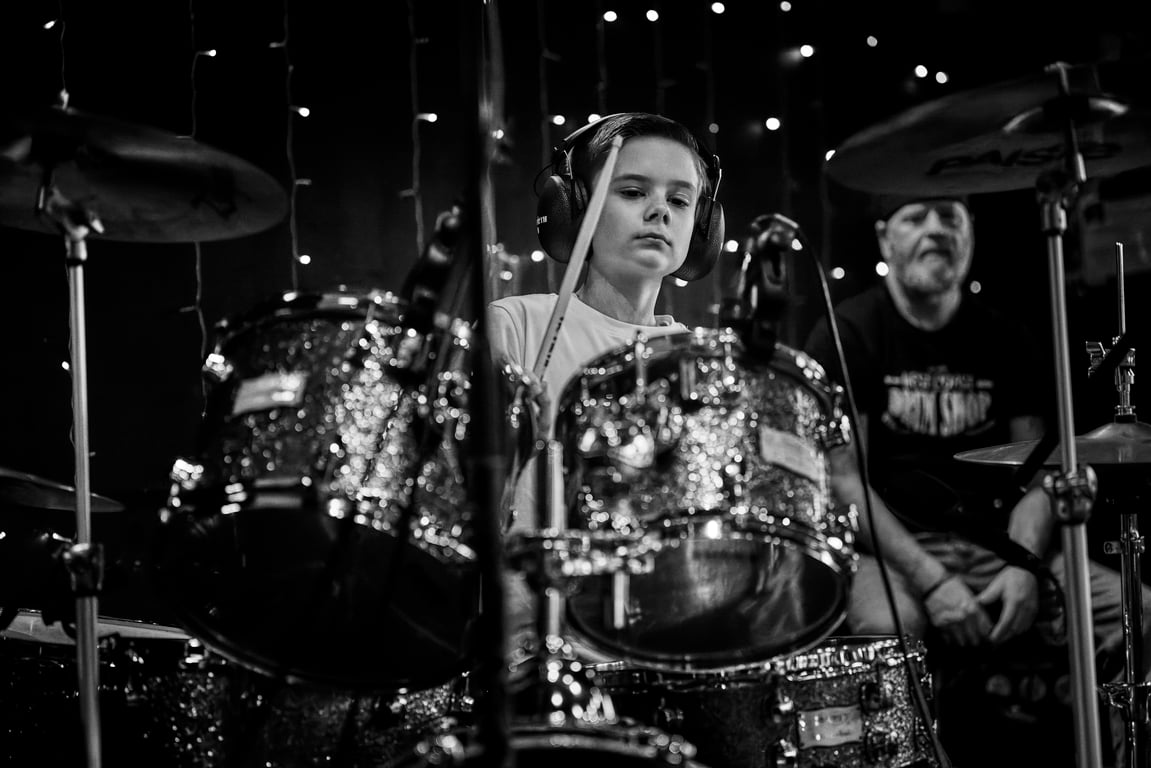 Crowd enjoying a live drum performance during a recital