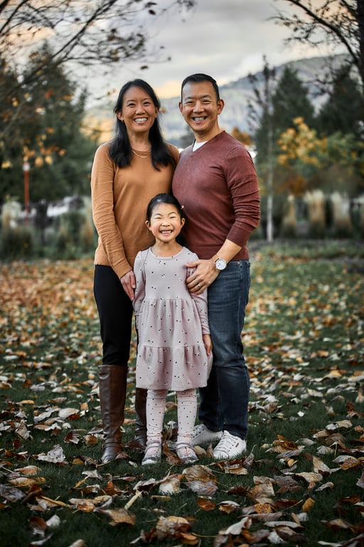 Parents and children posed together in a heartfelt group embrace