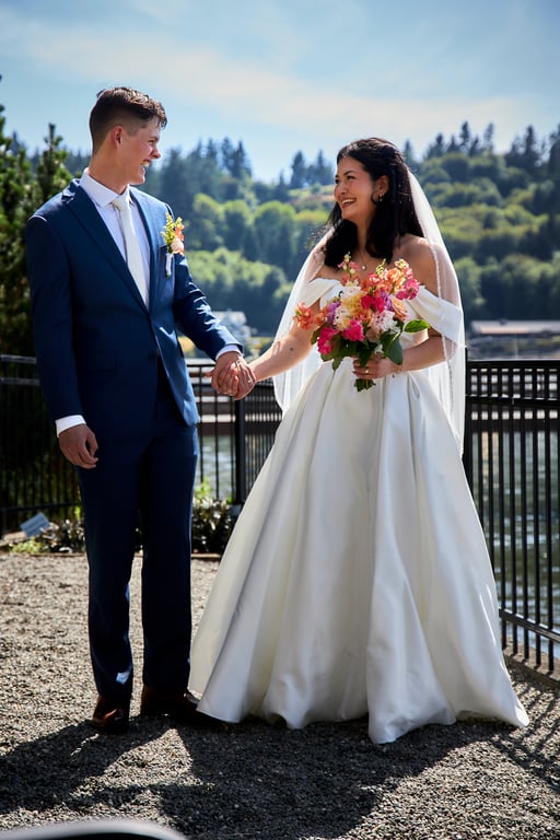Newlyweds walking hand in hand after the ceremony