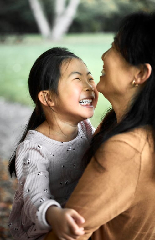 Family captured in a candid everyday moment outdoors
