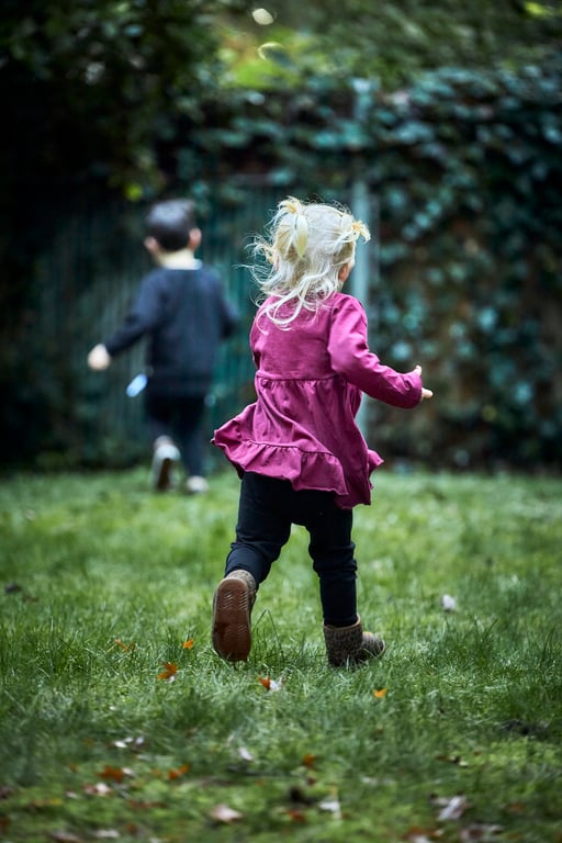 Young child playing in a warm outdoor setting