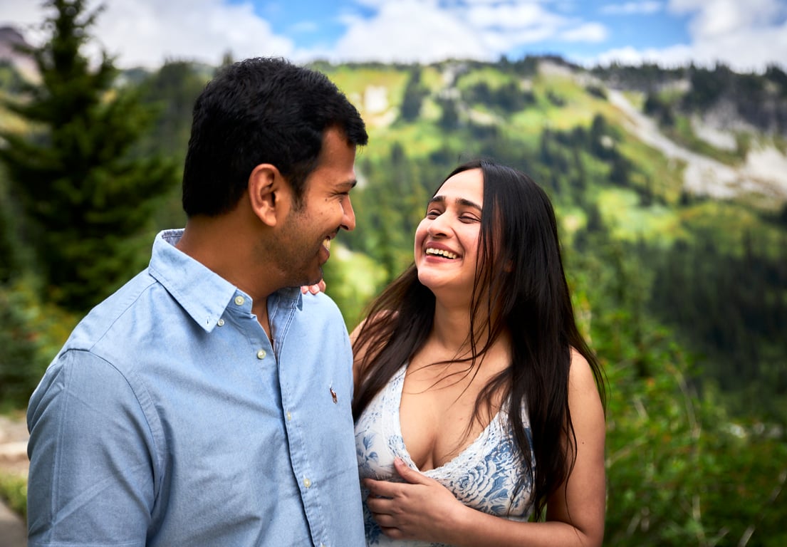 Candid couples moment surrounded by vibrant Pacific Northwest greenery