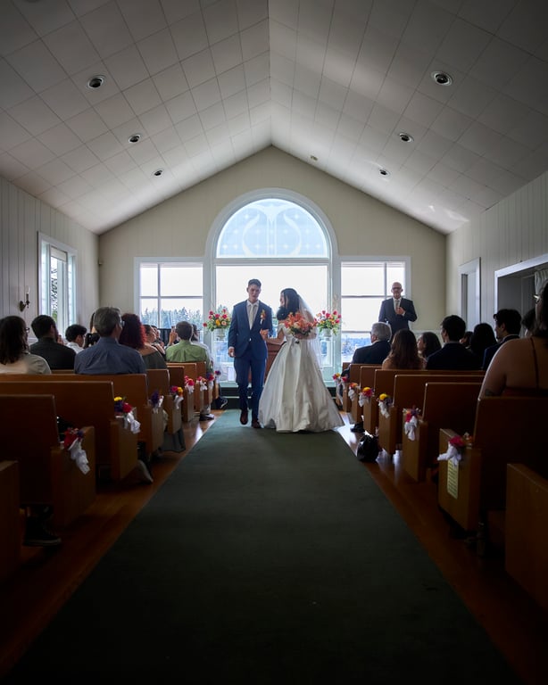 Newlyweds sharing their first kiss as a married couple