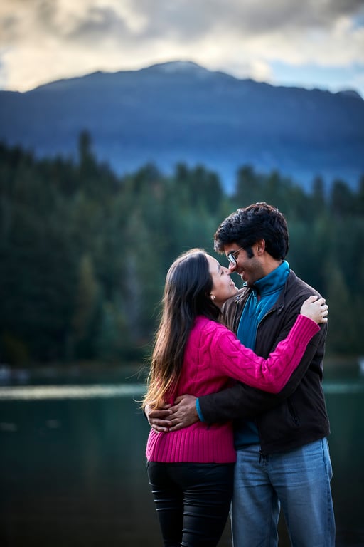 Couple laughing and looking at each other in soft daylight
